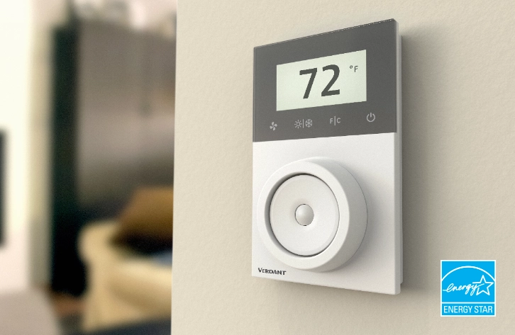 A Verdant ZX smart thermostat installed on a wall with a temperature of 72 Fahrenheit