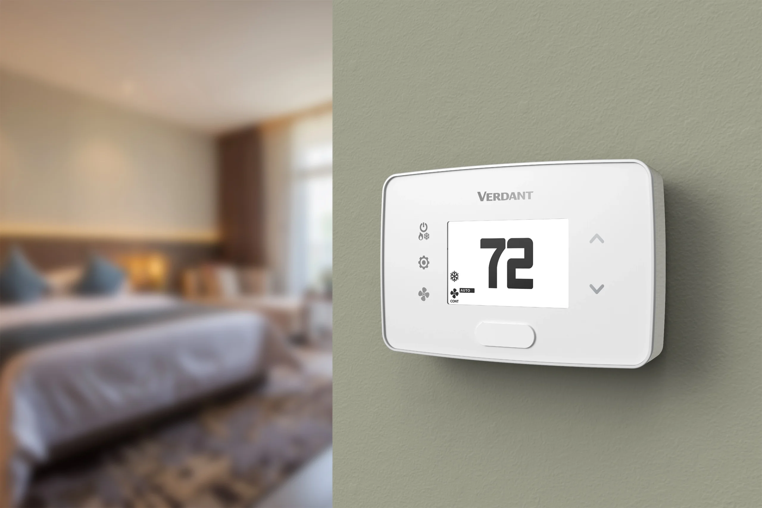 A Verdant VX4 wired smart thermostat (in black) installed in a hotel room to improve energy management