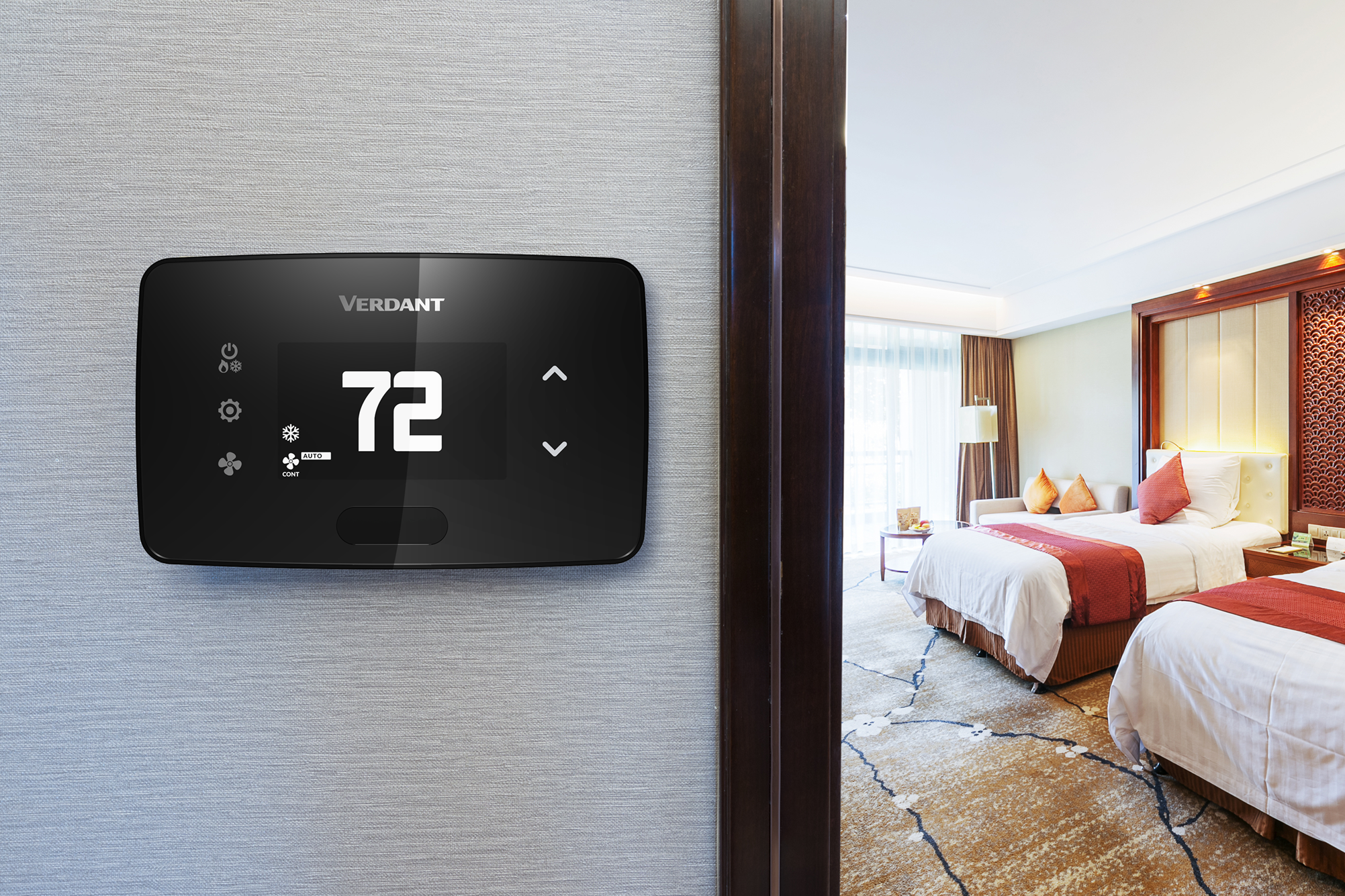 Man pointing on his phone to an energy management rebate with a Verdant VX4 smart thermostat installed in the room